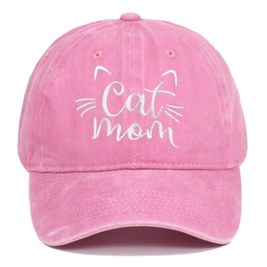 Detailed view of pink washed cotton fabric and white Cat Mom embroidery on baseball cap