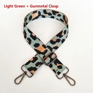 Detail of adjustable nylon leopard print bag strap in light green with gunmetal hooks
