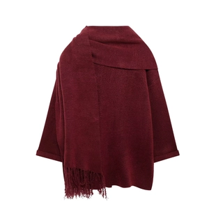 Detail of burgundy knit shawl cardigan featuring scarf collar and fringe tassels