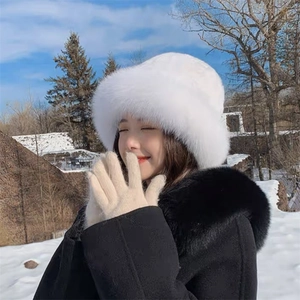 Winter faux fur Mongolian hat in white with matching gloves for outdoor warmth