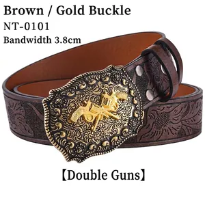 Detail of western cowboy leather belt with floral embossing and golden dual gun buckle