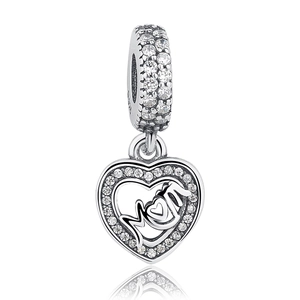 Detail of silver heart charm with MOM inscription and sparkling crystals for jewelry