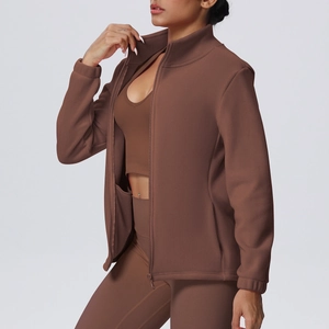 Detail of high collar zip-up sports jacket in dark brown with premium elastic fabric