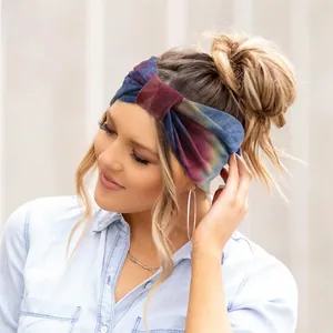 Macro detail of elastic tie-dye knotted headband with deep blue and wine red gradient