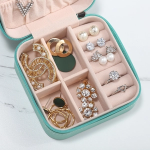 Portable mint green jewelry travel case with soft velvet interior for rings and earrings