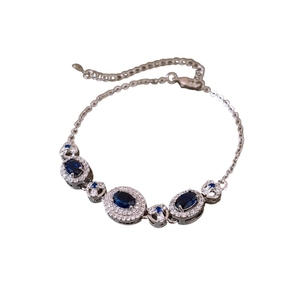 French palace style silver bracelet with oval deep blue gems and sparkling white zircons