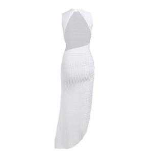 Detailed view of white textured fabric and backless design on this summer maxi dress