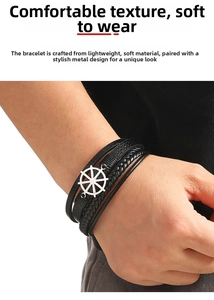 Detail shot of men's leather nautical bracelet with silver anchor helm charm