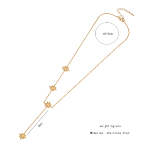 Macro detail of gold stainless steel star pendant necklace with length and weight specs