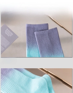 Detail of high-elasticity ribbed cuff on purple and blue gradient crew socks