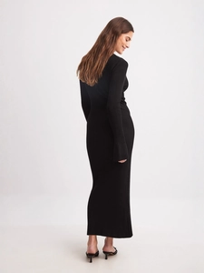 Elegant black ribbed knit long sleeve maxi dress featuring a slim fit and deep V-neckline