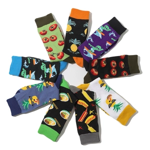 Vibrant crew socks set with fruit and cartoon prints in a creative circular display