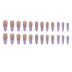 Long ballerina press-on nails with purple floral patterns and glitter butterfly accents