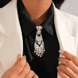 Close-up of sparkling rhinestone necktie brooch on a professional suit collar