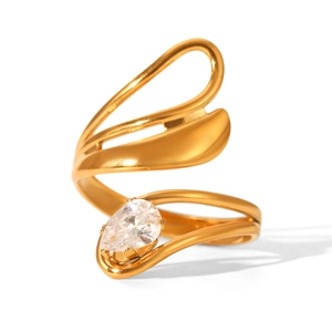 Detailed macro view of 18k gold-plated ring featuring pear-cut cubic zirconia and wave band