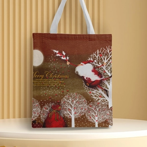 Detail of canvas tote bag featuring Santa's sleigh design and Merry Christmas text