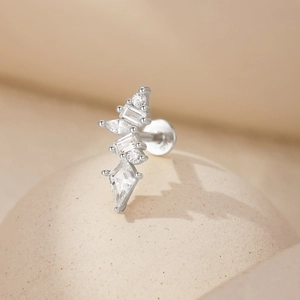 Macro detail of S925 sterling silver ear stud featuring geometric crystals and hallmark