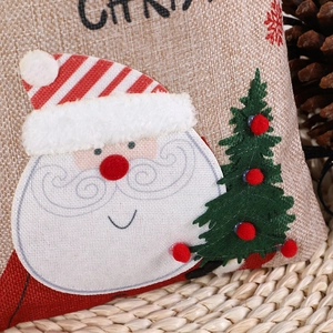 Christmas drawstring gift bag featuring Santa Claus and tree with fabric embroidery