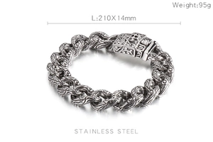 Detailed close-up of retro silver stainless steel bracelet with interlocking skull patterns