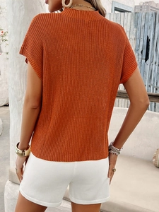 Women's casual orange knit short sleeve sweater and white shorts set for summer vacation
