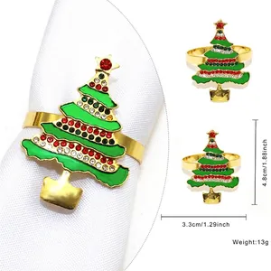 Detail of Christmas tree napkin ring with green enamel and colorful rhinestones