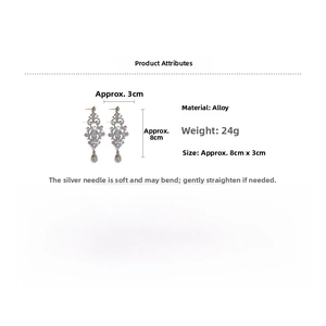 Detailed view of teardrop crystal drop earrings with 8cm length and silver needle studs