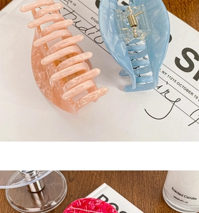 Macro shot of acetic acid hair claw clip with durable metal spring for elegant updo styling
