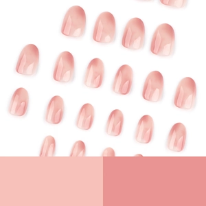 Pink gradient short round press-on nails with translucent jelly finish on white background
