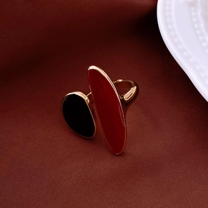Detail of a vintage leopard print open ring with red and black enamel in gold finish