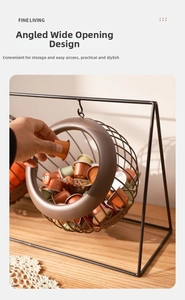 Close-up of black iron wire coffee pod basket with an angled open design for easy access
