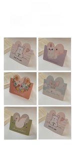 Close-up of cute cartoon heart-shaped greeting cards with various animal illustrations