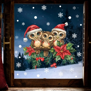 Detail of Christmas window stickers featuring brown owls with red hats and white snowflakes
