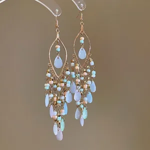 Boho-Ohrringe mit Acrylperlen-Quasten, geometrischem Goldrahmen und Wassertropfen