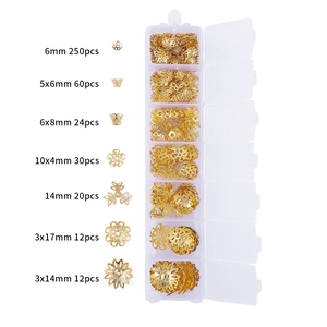 7-grid box set of gold jewelry findings including lobster clasps and open jump rings