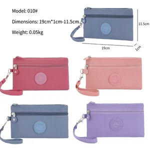 Minimalist nylon zipper phone pouch set in five versatile colors with wrist straps