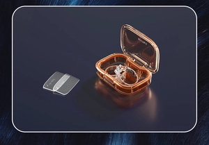 Detail view of orange portable pill box with two transparent anti-oxidation gaskets