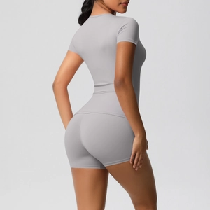 Detail of light grey seamless yoga set featuring slim fit top and high waist shorts