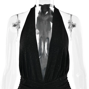 Detail of black V-neck backless shimmering dress with ruched waist and halter neck design