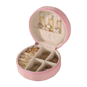 Pink round portable jewelry organizer with necklace hooks and ring slots for travel
