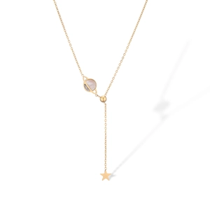 Detail of gold-plated Y-necklace with pink shell planet and star pendant on white backdrop