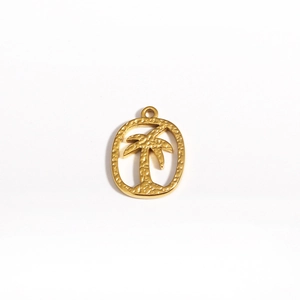 Macro shot of gold-plated stainless steel oval pendant with a cutout coconut tree design
