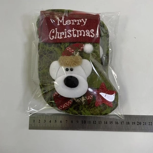 Detail of Christmas stocking with 3D polar bear and Merry Christmas embroidery