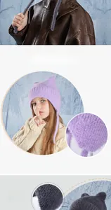 Close-up of kids winter knit hat showing soft texture and 9cm wide protective earflaps