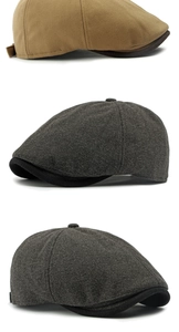Detail of herringbone wool baker boy caps in khaki and dark grey with top button
