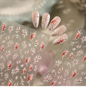 Detail of floral and butterfly nail stickers with 3D embossed texture and pearl accents