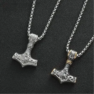 Detailed close-up of vintage Mjolnir Thor hammer pendants with intricate Viking knot carvings