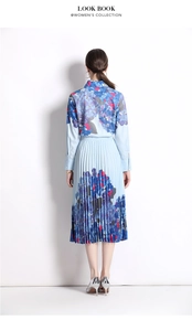 Detail of blue hydrangea print pleated skirt and long sleeve polo shirt from the back view