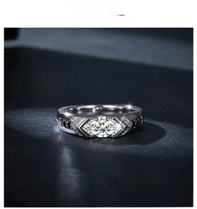Detail view of marquise-cut moissanite ring with black diamond side stones in silver
