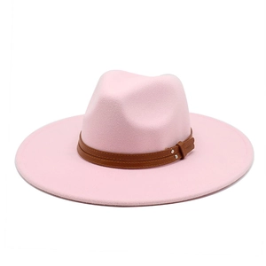 Detail of pink fedora hat featuring double brown leather bands and silver metal rivets