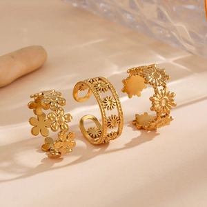 Three-piece set of adjustable gold floral rings with minimalist sunflower designs